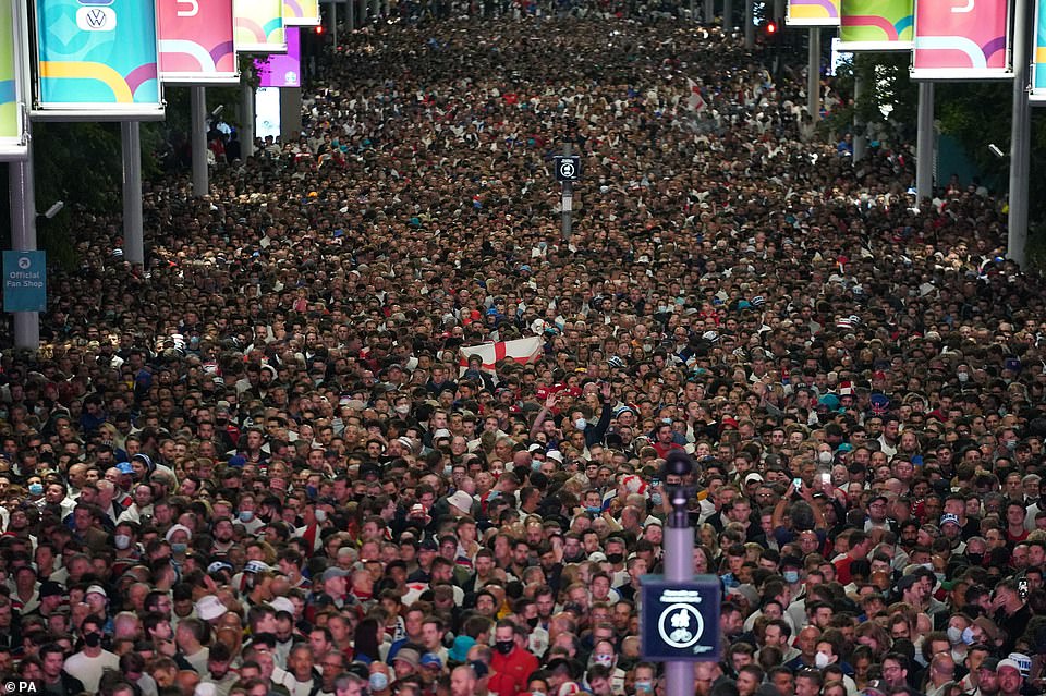 45183119-9771119-Sea_of_faces_as_thousands_of_jubilant_fans_pour_out_of_Wembley_S-a-14_1625844689027.jpg