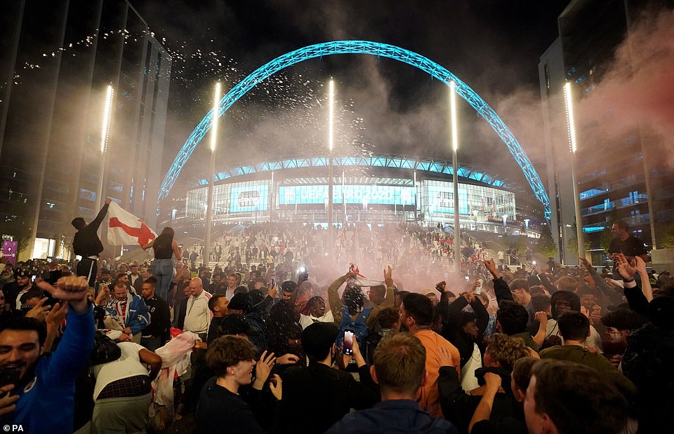 45183107-9771119-Fans_celebrate_outside_Wembley_Stadium_after_the_Three_Lions_qua-a-2_1625829809380.jpg