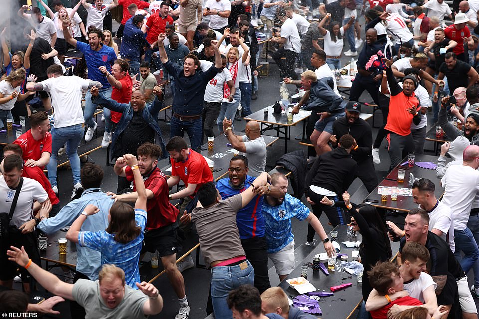 44829465-9737841-England_fan_celebrate_in_Boxpark_Croydon_after_England_s_Harry_K-a-128_1624993781467.jpg