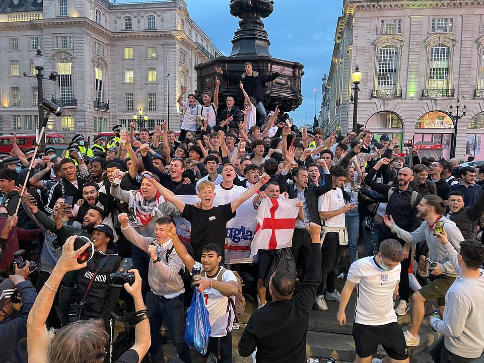 44837487-9738303-LONDON_Fans_were_seen_celebrating_in_Leicester_Square_after_Engl-a-170_1625011648296.jpg