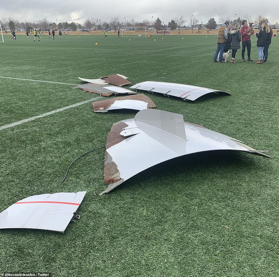 39559022-9282215-Pieces_of_the_aircraft_landed_on_a_football_field_as_seen_in_the-m-22_1613862656375 (1).jpg